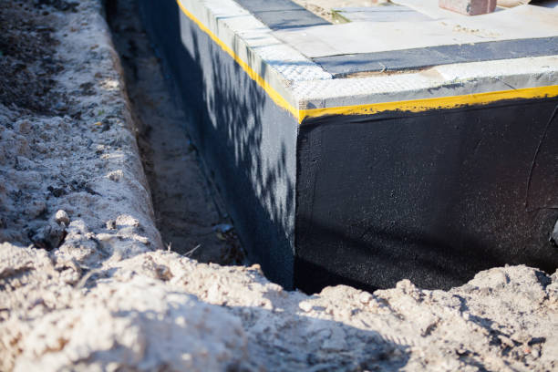 Professional Waterproofing technician working in Hazlet, NJ